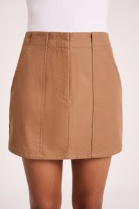 The Brisa Skirt in sepia is made from a heavyweight cotton twill fabrication which has a soft surface and smooth hand feel. The silhouette is high waisted with an a line shape. Features include an centre front zipper with hook and bar opening and side seam pockets.&nbsp;
