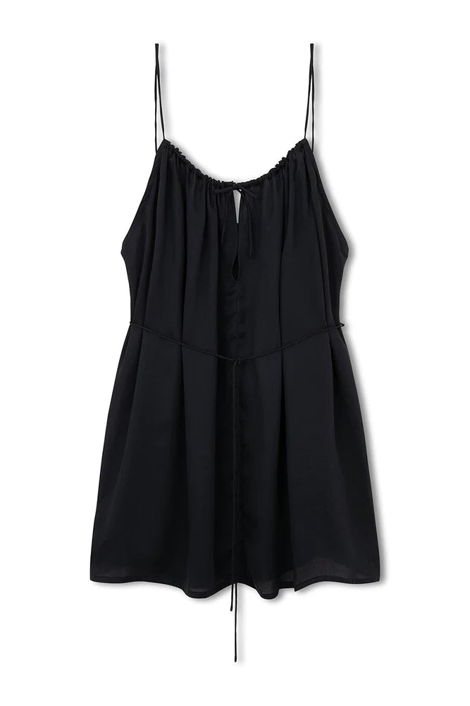 The Black Lenzing Tencel Mini Dress by Zulu & Zephyr is a lightweight Mini in a soft touch fabrication. The elegant scooped neckline, sits comfortably with an adjustable tie closure and key hole detail. This minimal Mini is perfect for beach to bar.