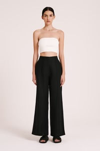 The Amani Tailored Linen pant in black is made from a premium linen which has been washed for a smooth, soft hand feel. The silhouette is a classic tailored fit with a high waist, wide legs and length finishing full length. Features include a functioning fly front, pin stitch on front leg and side seam pockets. 
