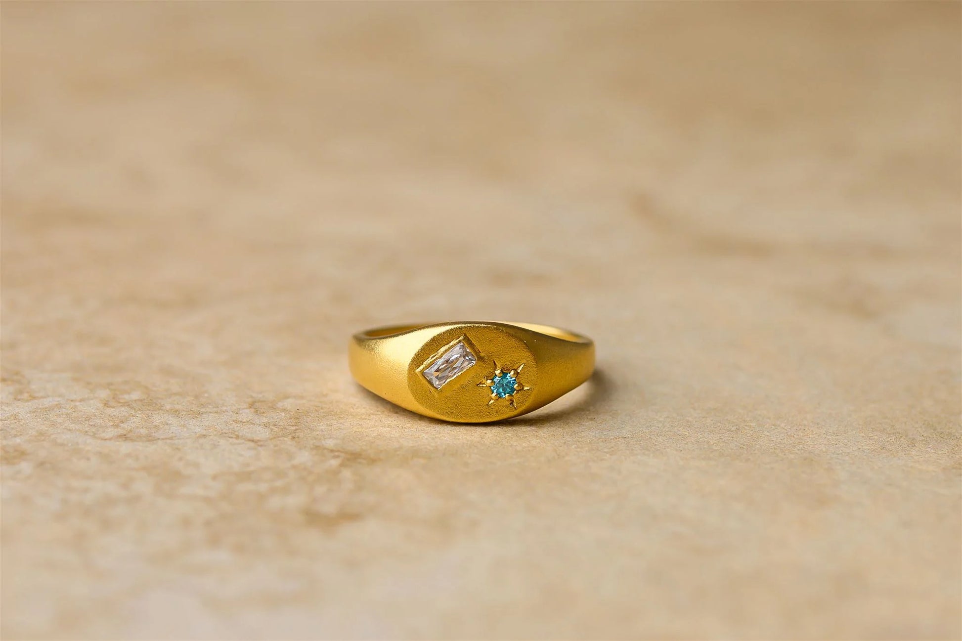 Add a pop of colour to your style with Lea, the stunning ring featuring a vibrant blue sapphire stone. Elevate any outfit with this eye-catching accessory. Perfect for making a statement without taking yourself too seriously.&nbsp;

925 Gold Plated Sterling Silver&nbsp;
Sapphire Stones
Lead,Nickel &amp; Tarnish Free
Hypoallergenic
Waterproof