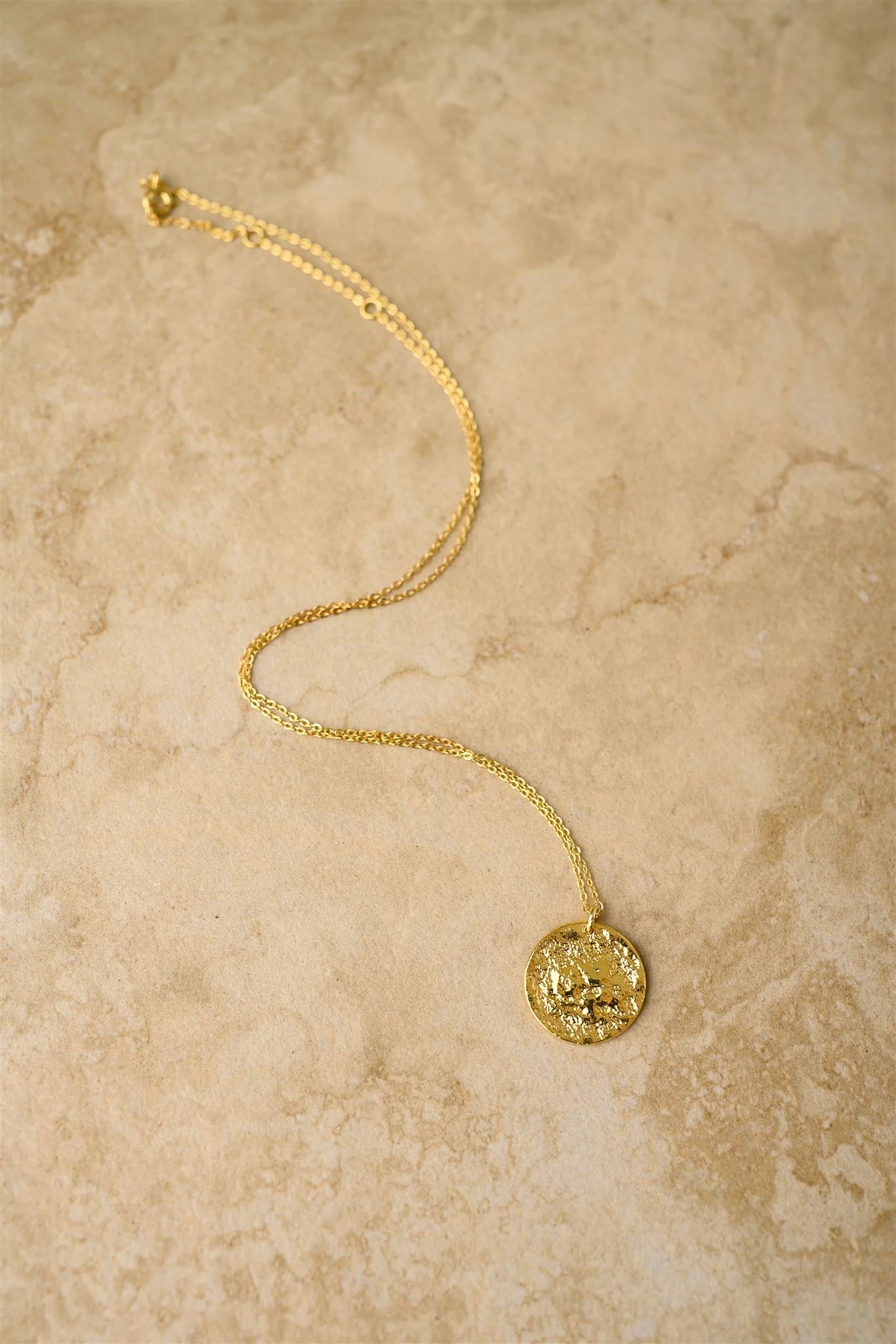 Add a touch of sparkle to your look with Josephine, the dazzling crushed gold keepsake pendant. Perfect for any occasion, this stunning pendant will be a precious addition to your collection.

925 Gold Plated Sterling Silver&nbsp;
Lead,Nickel &amp; Tarnish Free
Hypoallergenic
Waterproof

Dimensions

Length | 40cm + 2.5cm + 2.5cm

Pendant | 19 x 19 x 1.5mm