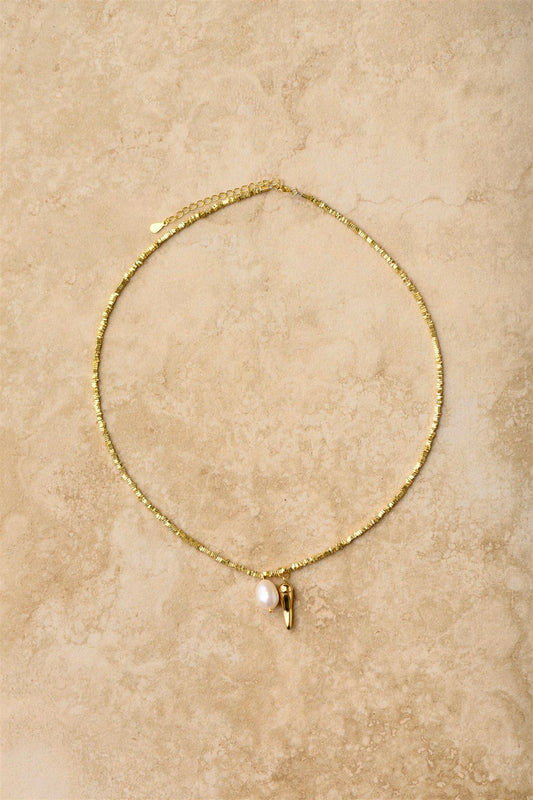 For a spicy touch of glam, this 24K gold chilli necklace on a crushed gold fine chain is a must-have. Adorn your neck with this lucky charm, believed to ward off evil and bring good luck. Perfect for adding some playful sass to any outfit. 

24k Gold Plated Sterling Silver 
Lead,Nickel & Tarnish Free
Hypoallergenic
Waterproof