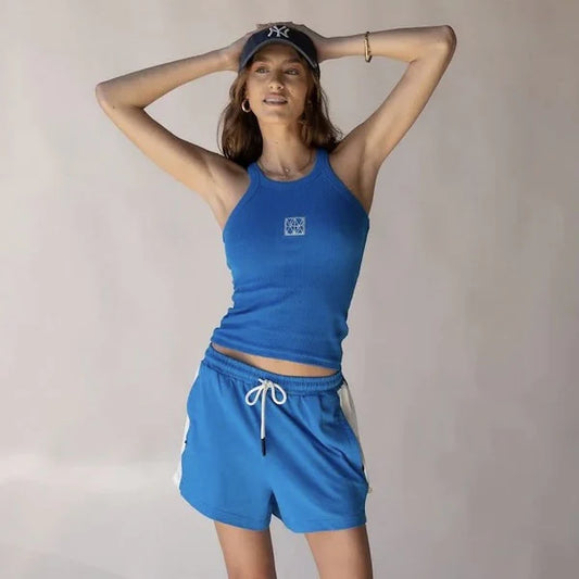 Introducing our Monogram Tank in Snow, crafted from a fine cotton elastane rib fabric with our signature monogram embroidered at the front. Thoughtfully updated from our best-selling Classic Tank, this style is a chic shape with thin straps, high-cut neckline and racer-style back. Our Monogram Tanks perfectly complement our new Classic Trackpants with your fave AJ sweatshirt around the shoulders.