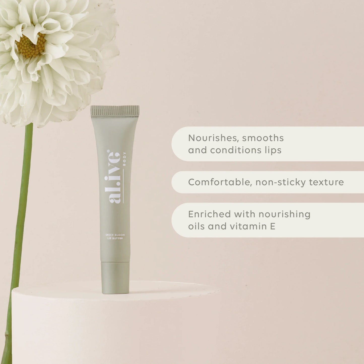 A nourishing 15ml Sheer Bloom Lip Butter enriched with Vitamin E and nourishing oils to support hydration and softness. Lightly scented with a soft, sweet Ivory Bloom aroma inspired by white florals.