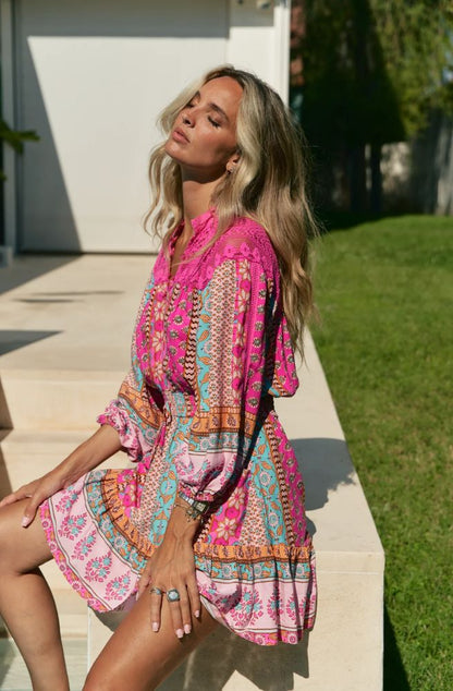 Feminine, vibrant, and effortlessly chic – the Cedella Print Olivia Mini Lace Dress is your go-to for sunshine days and balmy evenings. Designed in a flattering mini length, this dress features a striking mix of bold pinks, turquoise, and warm earthy tones in Jaase’s signature bohemian print.