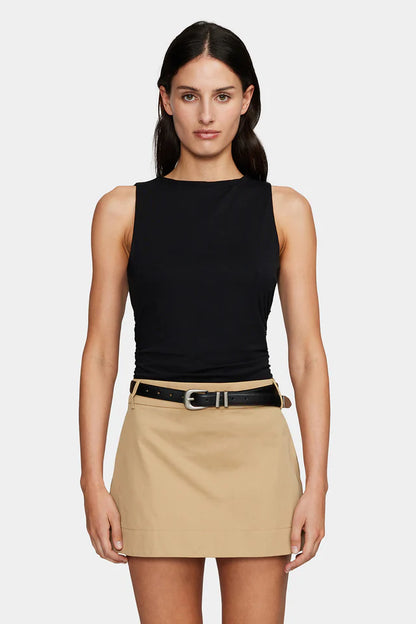 The Kali Top has a high neckline, gathering in the waist to flatter the figure and an asymmetrical hemline. The top is cut from a stretch fabrication for a sleek form fitting silhouette.
