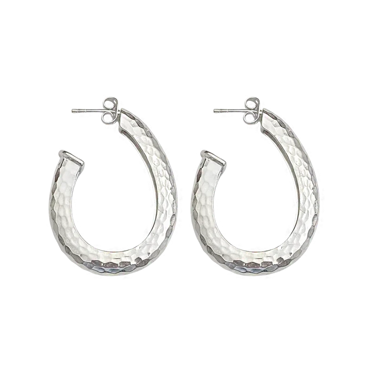If you need a hoop to take your daily style up a notch, or if you'd like a few more pieces to complete your collection, we present to you the ever popular Kitty Hoops, now in Silver! These oval shaped hoops exude attitude and can provide a bold flair to any look. Whether you're headed out on the town or just grabbing coffee with a friend, let these statement earrings add a bit of extra sass to your style. Remember, you can never be too much honey!