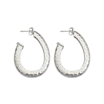 If you need a hoop to take your daily style up a notch, or if you'd like a few more pieces to complete your collection, we present to you the ever popular Kitty Hoops, now in Silver! These oval shaped hoops exude attitude and can provide a bold flair to any look. Whether you're headed out on the town or just grabbing coffee with a friend, let these statement earrings add a bit of extra sass to your style. Remember, you can never be too much honey!