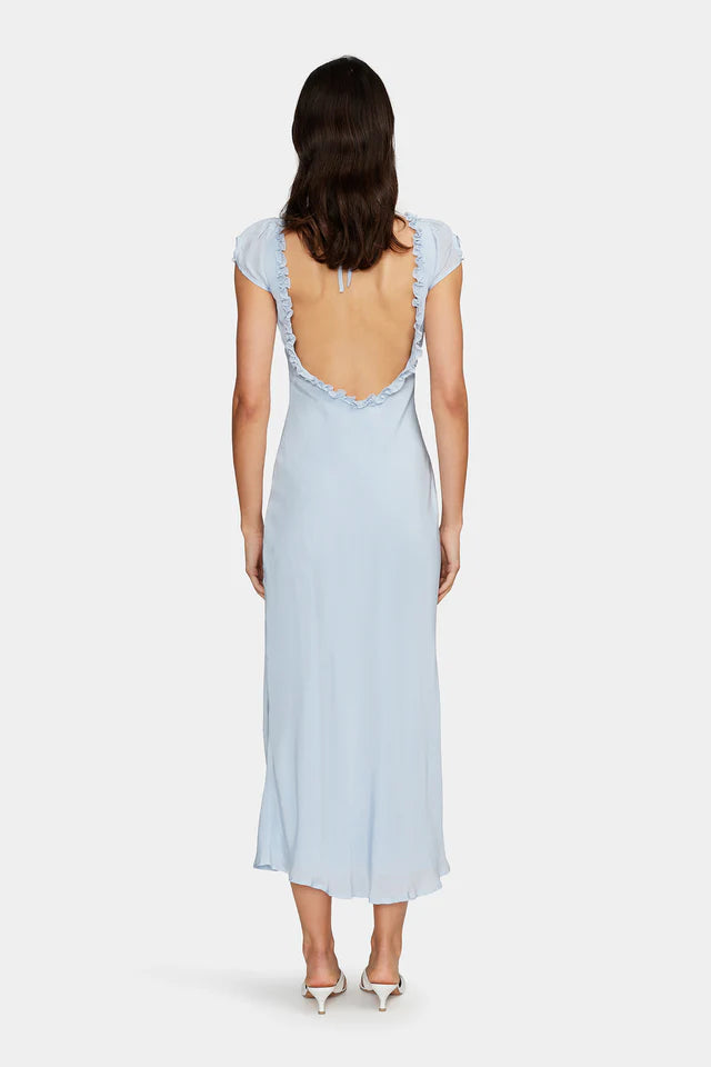 The Lottie Midi Dress is a bias cut slip dress with a low V neckline and a low scooped back. The dress has a ruffle detail around the neckline and cap sleeves. There is a tie at the back of the shoulders to secure the dress and it is fully lined. A gorgeous piece to dress up or down for any occasion.