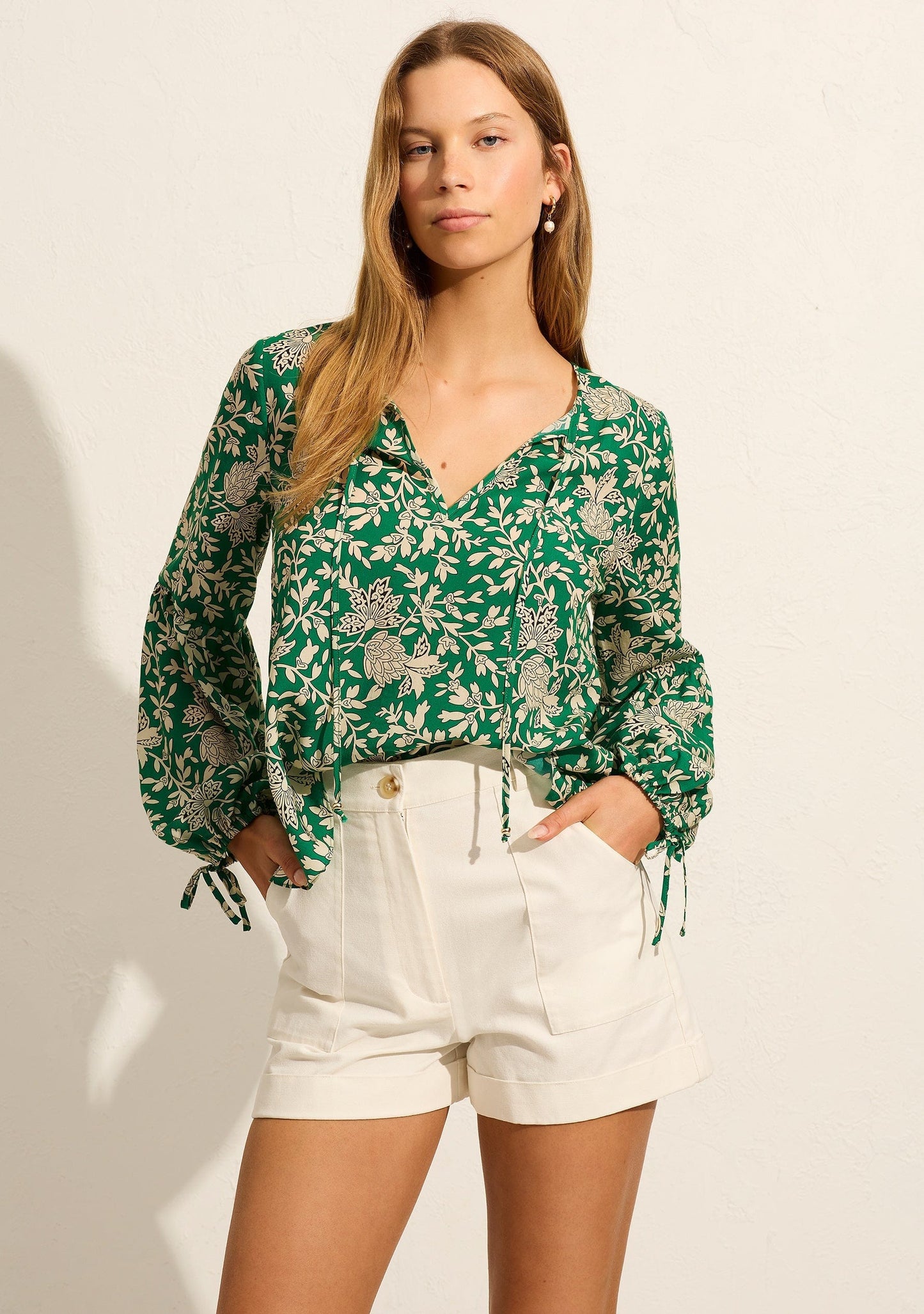 The Lennox Blouse by Auguste is crafted from soft tencel in our fresh apple green Cyrus print. It features a V-neckline with a tie detail, blouson sleeves with elasticated cuffs, making it your new go-to blouse.


- V neckline with tie detail
- Long sleeves with an elasticated cuff and tie detail
- Fits true to size, go with your usual
- 100% Tencel
- Semi-sheer, non-stretch fabric with a soft drape and hand feel
- Cold hand wash