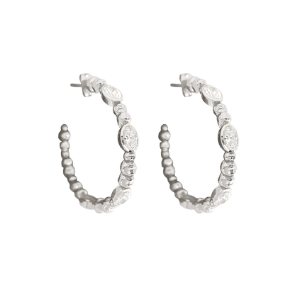 Hello Lex! She’s fun, fresh and you should know she’ll be sure to add a little sparkle to any look. The Lex earrings are a hoops style featuring ball work and a hammered finish. Dazzling White CZ placed in a cool silvery setting. Inspired by hot summers in the city… We’re obsessed and CAN NOT take her off! she's a must for your collection.&nbsp;