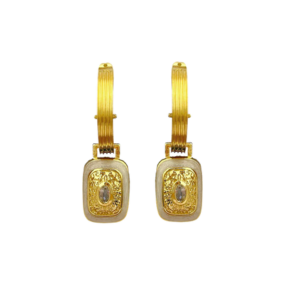 The&nbsp;Mara's are the epitome of classic style with a fabulous yet playful twist.&nbsp;They're beautiful, chic, and oh-so sassy… Crafted on a chunky fluted hoop, they feature a unique rectangle motif drop, combine with hammered gold texture,&nbsp;pearlescent enamel&nbsp;and eye-catching&nbsp;faceted Crystal Quartz&nbsp;gemstones. The Mara Earrings&nbsp;can be worn from day to night, with dazzling yet sophisticated flair that’s sure to turn heads. Enjoy the perfect balance of classic yet flirty with these 