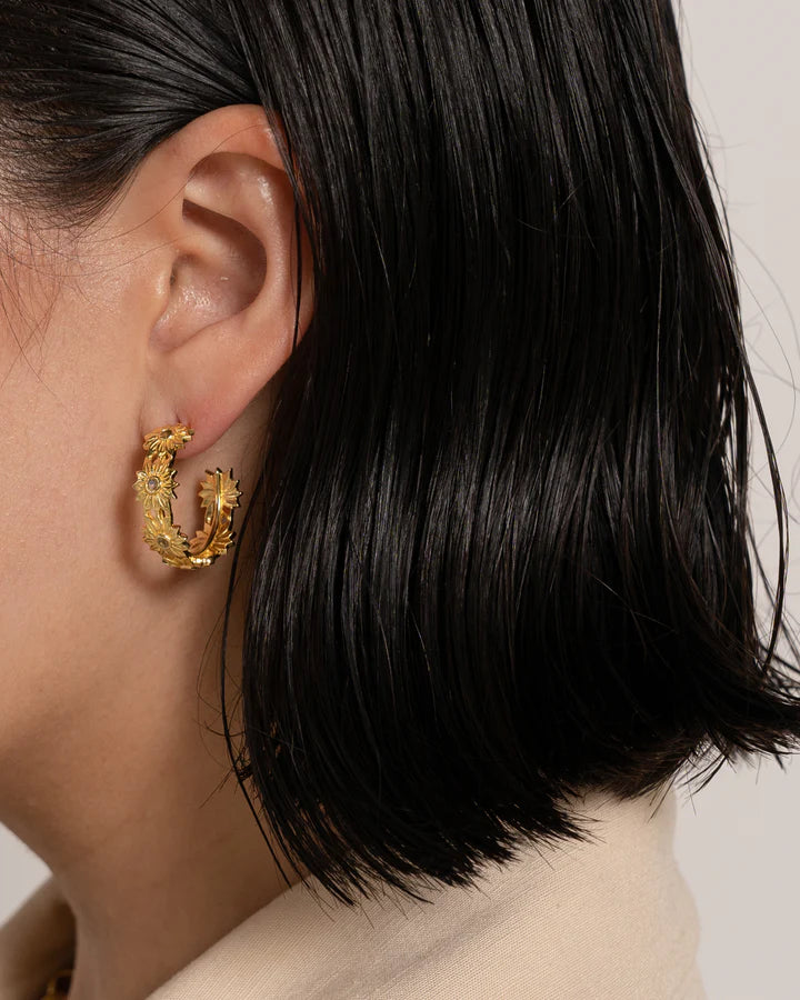 Cute, fun, fresh, floral, easy, breezy, beautiful! The Kareena earrings have become everyone's favourite little hoop to accessorise any outfit and bring some sunshine to every day. With glittering Citrine gemstones that capture the light and have you feeling your happiest. Every MM girl needs the Kareena's in their jewellery collection.&nbsp;