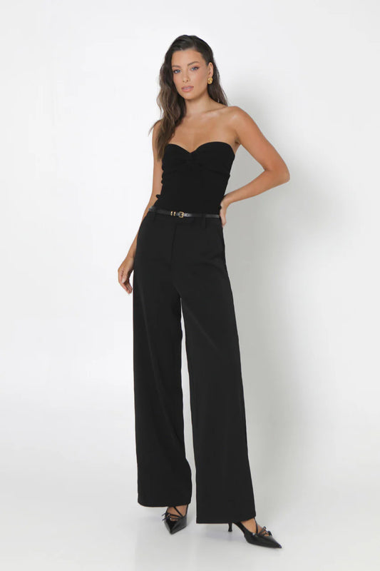 Black strapless knit top by Madison the Label.