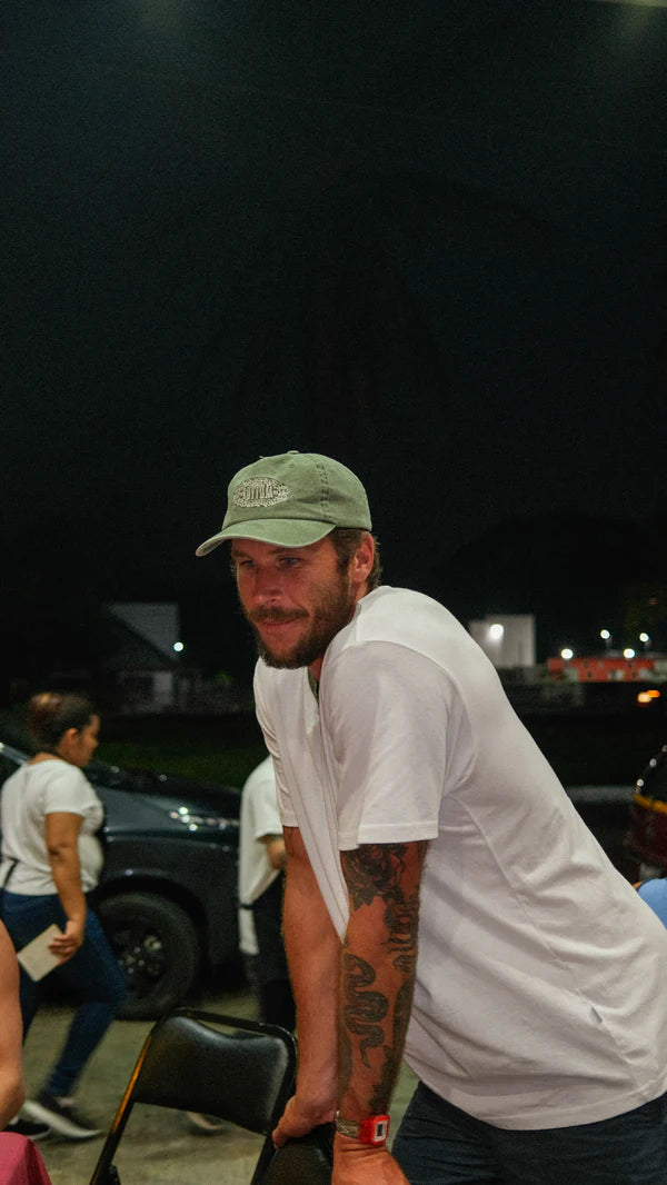 A soft, lightweight cap with a low-profile shape. Made from pigment-dyed cotton twill with an adjustable brass slider and tonal embroidery.