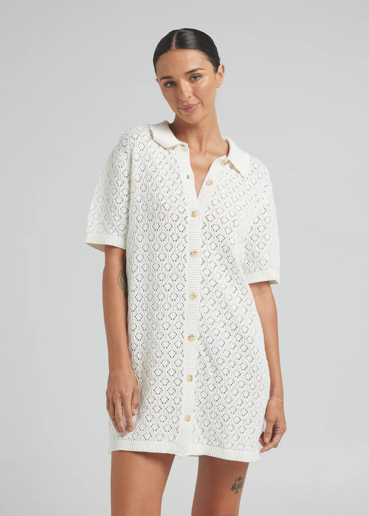 A lightweight and versatile wardrobe essential. An effortless, timeless style, the Mimosa Knit Shirt Dress is crafted in a soft 100% Cotton yarn that'll keep you cool from sunrise to sunset.