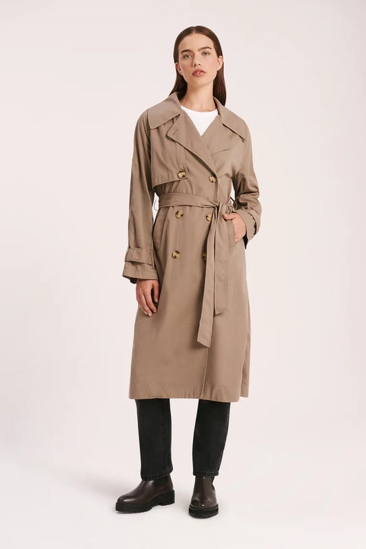 The Odyssey Trench coat is made from a sturdy cotton nylon blend with a peached/sueded finish. Fit is relaxed with wide full length sleeves &amp; body length finishing at knee level. Features include traditional trench coat detailing, double breasted button opening, waist tie, storm flap.