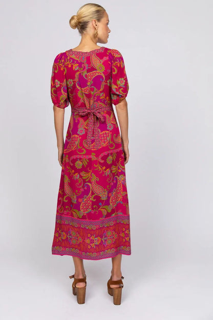 Our Nicola midi dress is all about easy charm and everyday wearability. With soft puff sleeves, a classic square neckline, and apron-style ties that cinch at the back, it blends a timeless silhouette with a hint of playful detail. A flattering fit that feels as good as it looks—perfect for all body shapes and sizes. 
