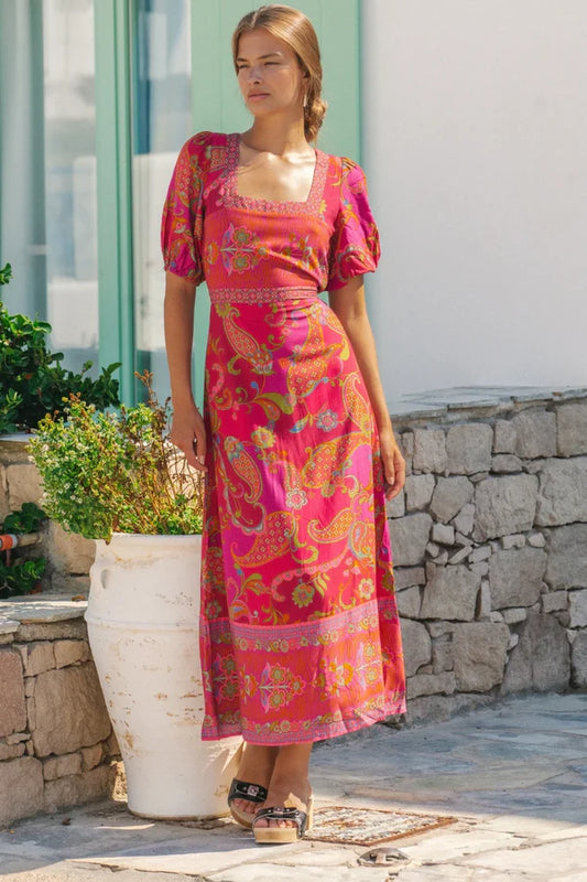 Our Nicola midi dress is all about easy charm and everyday wearability. With soft puff sleeves, a classic square neckline, and apron-style ties that cinch at the back, it blends a timeless silhouette with a hint of playful detail. A flattering fit that feels as good as it looks—perfect for all body shapes and sizes. 
