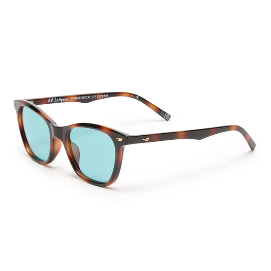 Offering a classic vintage aesthetic, our NONSENSICAL sunglasses are a mid size unisex frame suited to most face shapes. Designed with subtle flagstripe rivets and vintage inspired temple shape, this style provides timeless appeal.

• Finished in a dark tortoisehell frame with mid tone blue lenses.
• A lightweight, durable and impact resistant frame.
• Fitted with shatterproof and scratch resistant polycarbonate lenses.