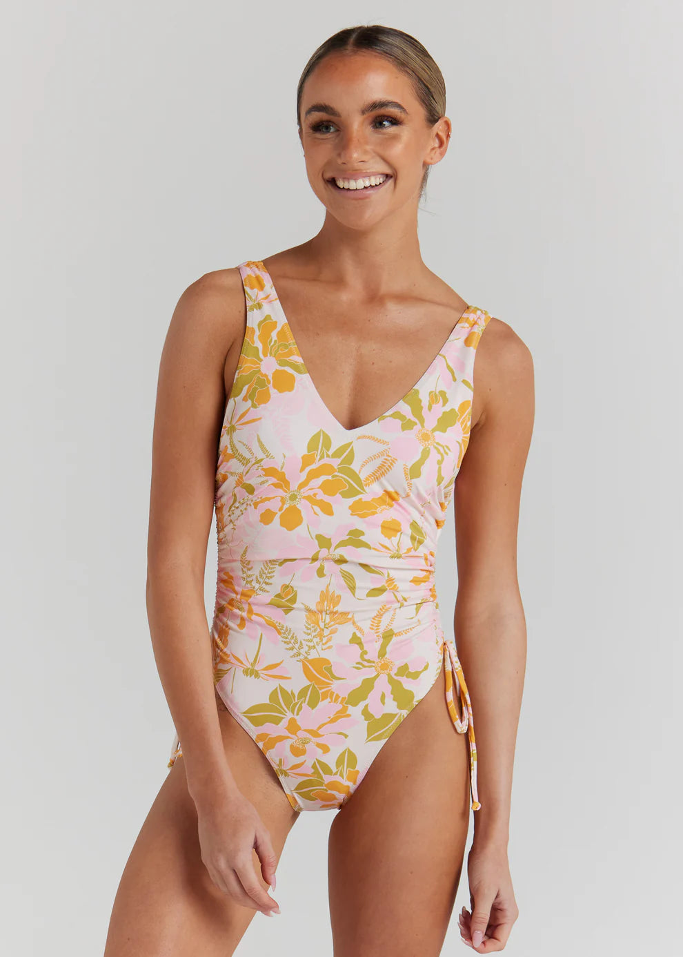 One of our most loved silhouettes in our new vintage inspired floral for the season. Designed with a flattering high cut leg featuring adjustable side ties, the Positano One Piece is a modern interpretation of a classic shape.