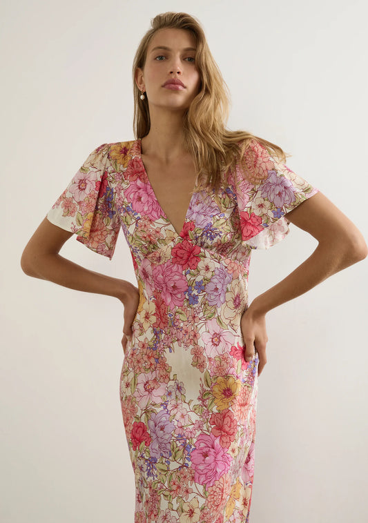 The Calais Midi Dress in the new Ode Floral is a fresh take on the best-selling Pamela Midi Dress, designed for effortless elegance. Featuring a V-neckline, under-bust seam with soft gathers, and short flutter sleeves, this dress offers a feminine and flattering fit. The bias-cut silhouette beautifully skims the body, enhancing natural curves, while the invisible side zip fastening ensures a seamless finish. Crafted from 100% viscose in a floral satin-finish jacquard, the lightweight, non-stretch fabric has