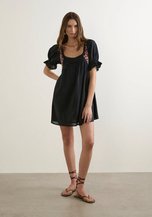The Lana Mini Dress in black is a sweet bohemian-inspired summer staple, adorned with warm-toned hand embroidery, lace trims, and short puff sleeves with frilled cuffs. With pintucks, soft shirring, and a floaty silhouette, it’s effortlessly feminine for sunshine days and warm nights.

Our studio model Kasia is 182cm / 5'11.5” and wears a Size S.&nbsp;