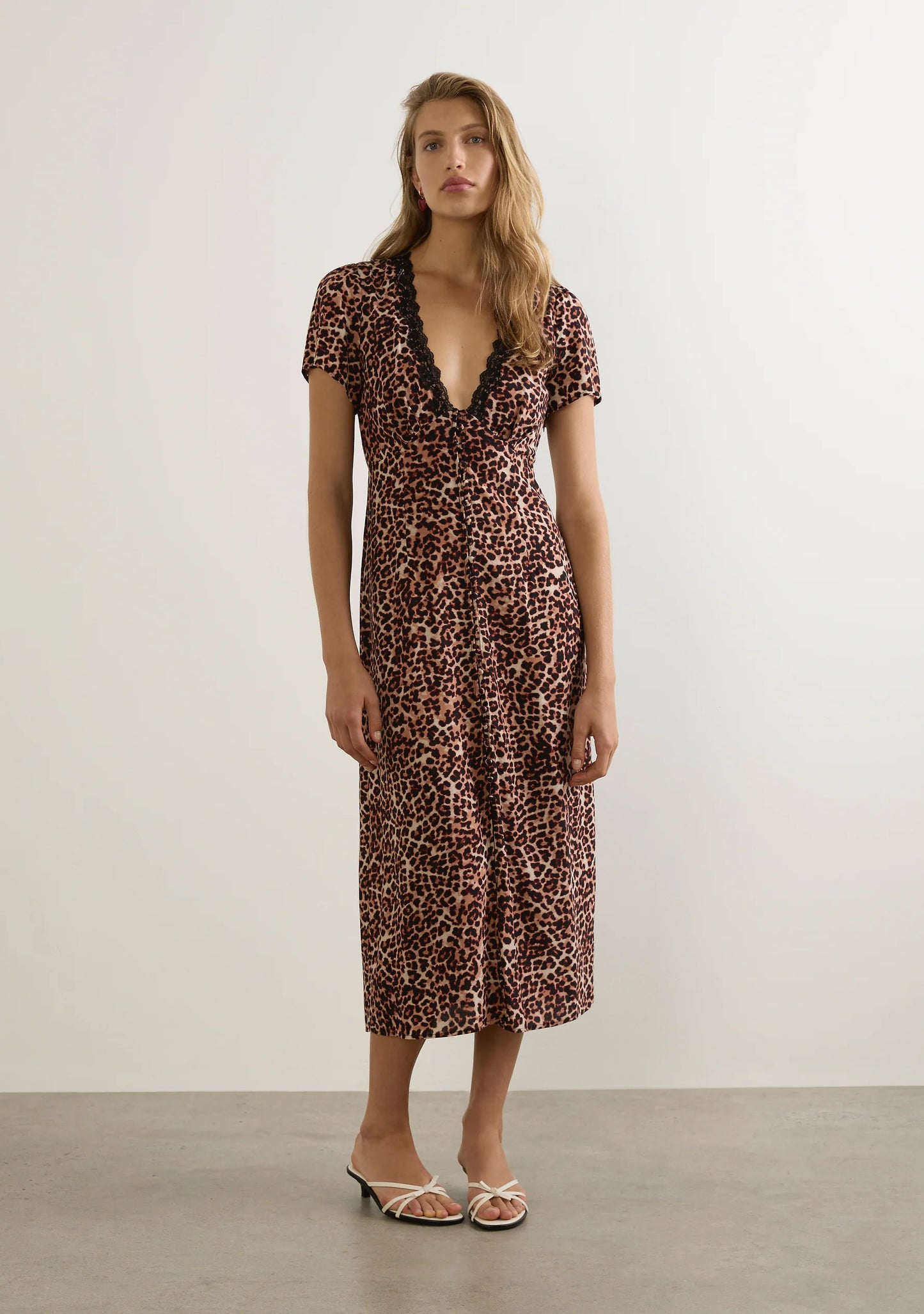 The Maureen Midi Dress in our Canyon Leopard print channels your inner ‘it’ girl with a flattering V-neckline, lace trim, and soft under-bust gathers. With flutter sleeves and a floaty silhouette, it’s a feminine summer stand-out with a graceful, flattering drape.

Our campaign model Malena is 176cm / 5'9" and wears a Size S.
Our studio model Yulia is 175cm / 5' 9” and wears a Size S.