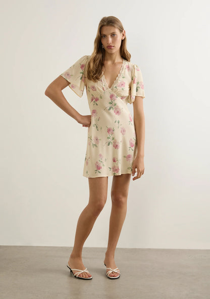 A brand-new silhouette ready for summer—the Sadie Mini Dress in the soft and feminine Nova floral. Featuring a delicate V-neckline with lace trim, a flattering under-bust seam with soft gathers, and a bias-cut silhouette that skims the body beautifully. Short flutter sleeves add a romantic touch, while an invisible side zip ensures a seamless fit. Crafted from a lightweight rayon-viscose blend with a soft drape. Fits true to size. Cold hand wash recommended.
