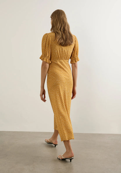 Nothing screams summer like the Mango Polka Dot. The Myles Midi Dress is a brand-new silhouette with a flattering bias-cut shape, contrast lace-trimmed neckline, and soft under-bust gathers. Finished with playful puff sleeves, it’s a feminine summer stand-out made for sunshine days.

Our studio model Yulia is 175cm / 5' 9” and wears a Size S.