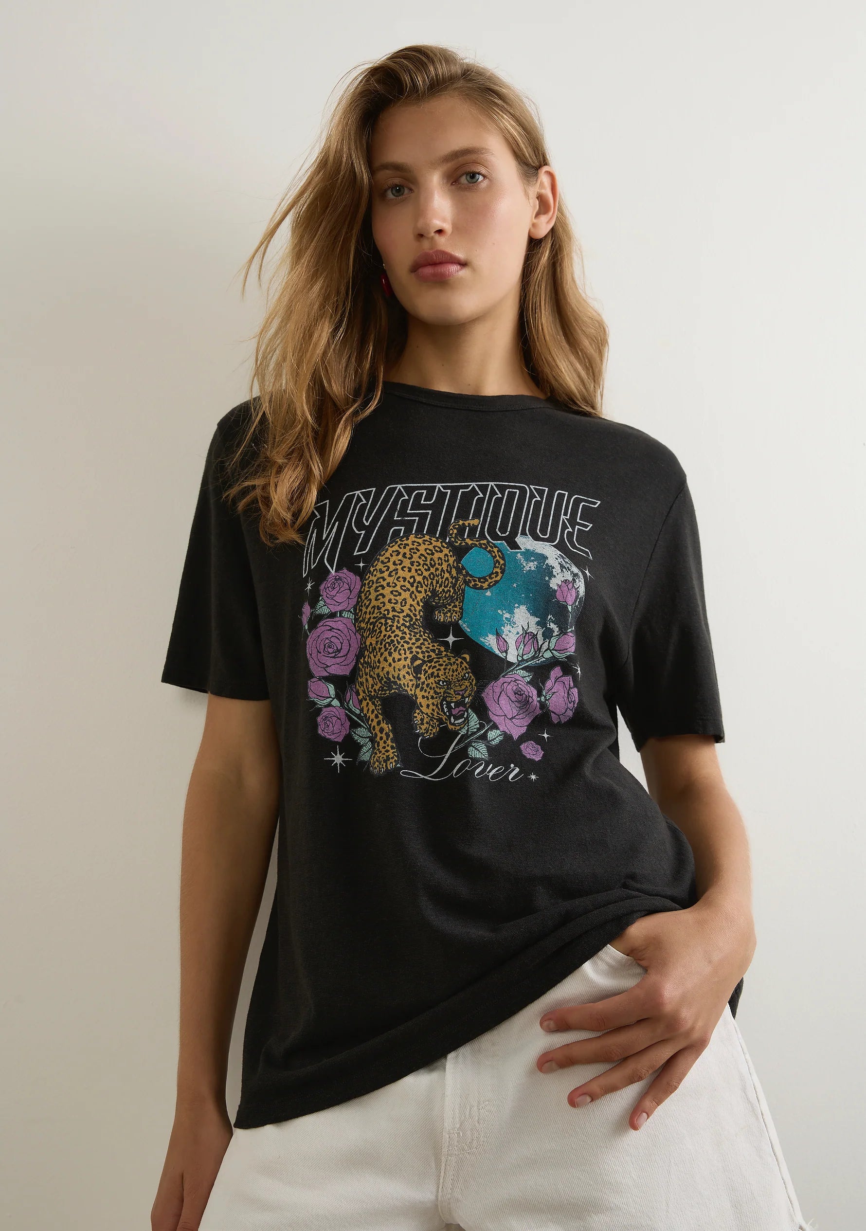 The Mystique Classic Tee in black is an effortless staple designed for everyday wear. Featuring a classic crew neckline and a true-to-size fit, this tee is crafted from a sustainable blend of 55% hemp and 45% organic cotton, offering a lightweight jersey fabric with a soft hand feel. A versatile essential with a luxe yet laid-back appeal, it pairs effortlessly with your favorite denim or floaty skirts. Cold machine wash recommended.