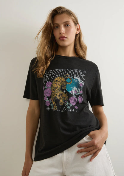The Mystique Classic Tee in black is an effortless staple designed for everyday wear. Featuring a classic crew neckline and a true-to-size fit, this tee is crafted from a sustainable blend of 55% hemp and 45% organic cotton, offering a lightweight jersey fabric with a soft hand feel. A versatile essential with a luxe yet laid-back appeal, it pairs effortlessly with your favorite denim or floaty skirts. Cold machine wash recommended.