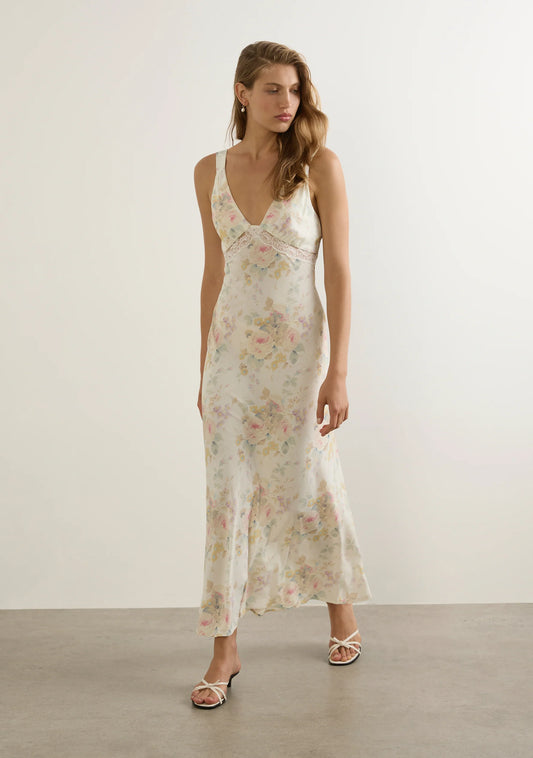 The Aurelia Midi Dress in our Opaline print is an ultra-feminine slip dress with thick straps, delicate lace inserts, and a softly gathered bodice. Designed with a tie-back waist and flattering bias-cut silhouette, it drapes beautifully for a romantic summer stand-out.

Our studio model Yulia is 175cm / 5' 9” and wears a Size S.