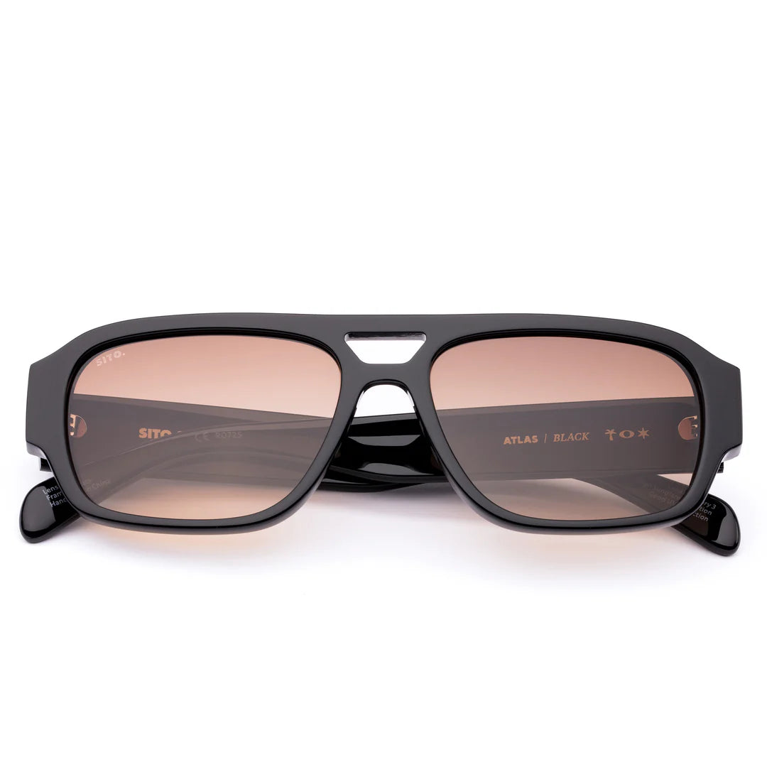 Wear your ticket to roam with Atlas in Black by&nbsp;Sito Shades. This lightweight aviator frame pairs bold confidence with effortless cool, perfect for sunrises, city streets, or spontaneous road trips. Crafted from durable eco acetate and fitted with premium UV lenses, Atlas keeps your eyes protected while moving seamlessly from adventure to everyday. Designed in Australia, it’s freedom with a refined edge — no itinerary required.

Lens Colour:&nbsp;Cedar Gradient