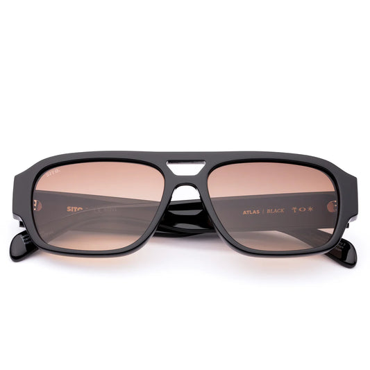 Wear your ticket to roam with Atlas in Black by&nbsp;Sito Shades. This lightweight aviator frame pairs bold confidence with effortless cool, perfect for sunrises, city streets, or spontaneous road trips. Crafted from durable eco acetate and fitted with premium UV lenses, Atlas keeps your eyes protected while moving seamlessly from adventure to everyday. Designed in Australia, it’s freedom with a refined edge — no itinerary required.

Lens Colour:&nbsp;Cedar Gradient