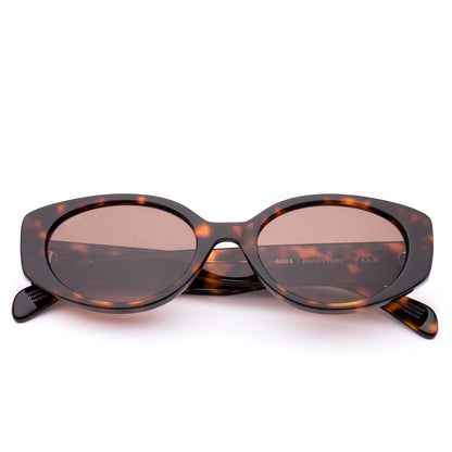 Confident and effortlessly stylish —&nbsp;Aura in Honey Tort&nbsp;is your go-to frame for every day. Its golden-brown tortoiseshell pattern pairs perfectly with casual weekends, brunch dates, or city adventures. Handcrafted from sustainable eco acetate and fitted with premium UV-protective lenses, Aura Honey Tort balances modern elegance with conscious design. Designed in Australia for effortless style and considered confidence.

Lens Colour:&nbsp;Coffee