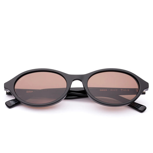 Cool, calm and confident in the most understated way, Orion in Black is the frame that goes with everything and outlasts every trend. Its softly rounded oval shape offers a universally flattering fit, giving effortless balance to any look — whether it’s jeans and a tee or your go-to summer dress. Handcrafted from plant-based acetate in a deep black and fitted with premium coffee tinted UV-protective lenses, Orion is equal parts timeless and sustainable. Designed in Australia for the woman who moves easily b