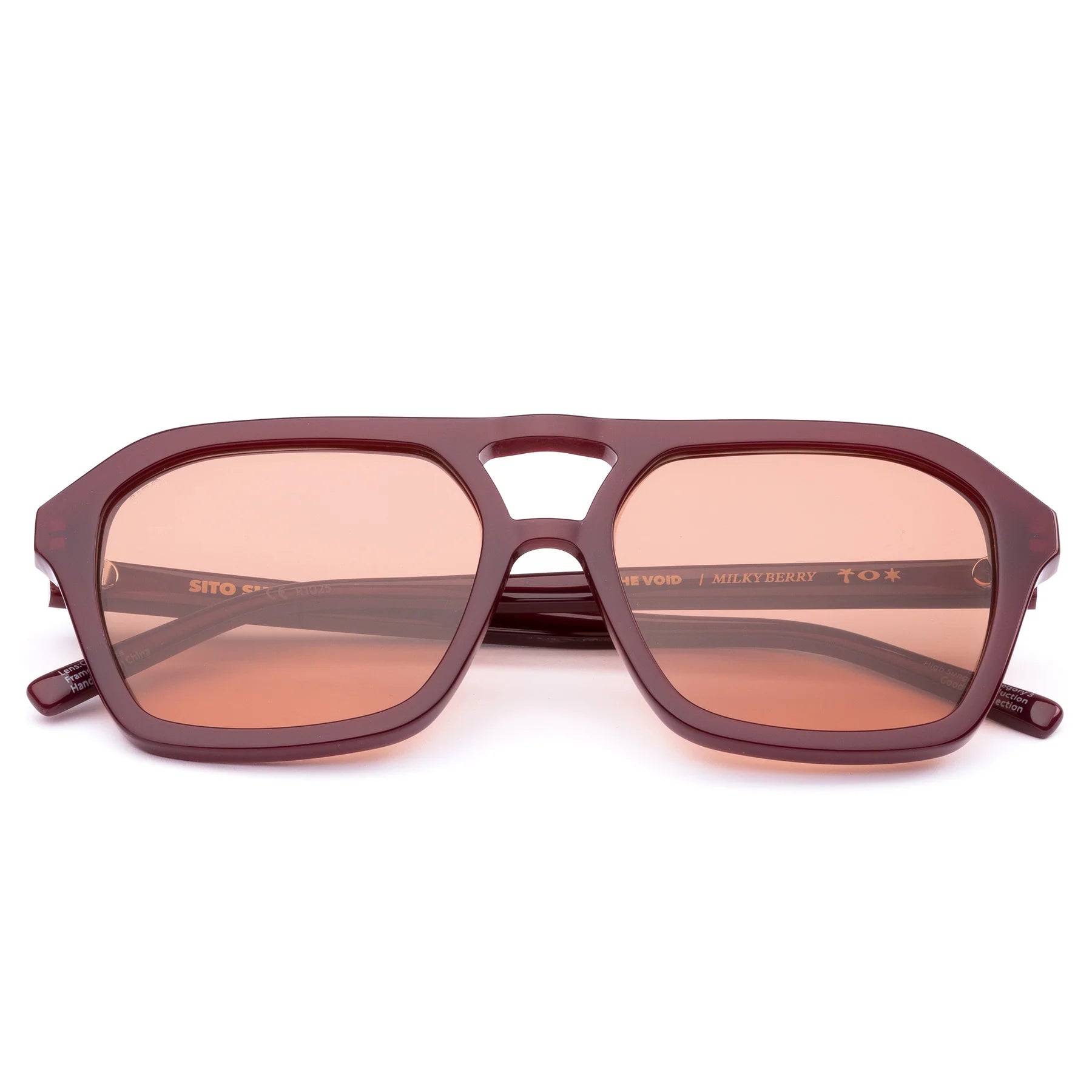 Step up your style with The Void Milky Berry. These unisex aviator sunglasses feature a bold nose bridge and clean, rounded frames in a rich berry tone, offering a modern take on 70s-inspired design. Handcrafted from eco-friendly acetate and fitted with premium lenses, The Void delivers comfort, clarity, and effortless cool.