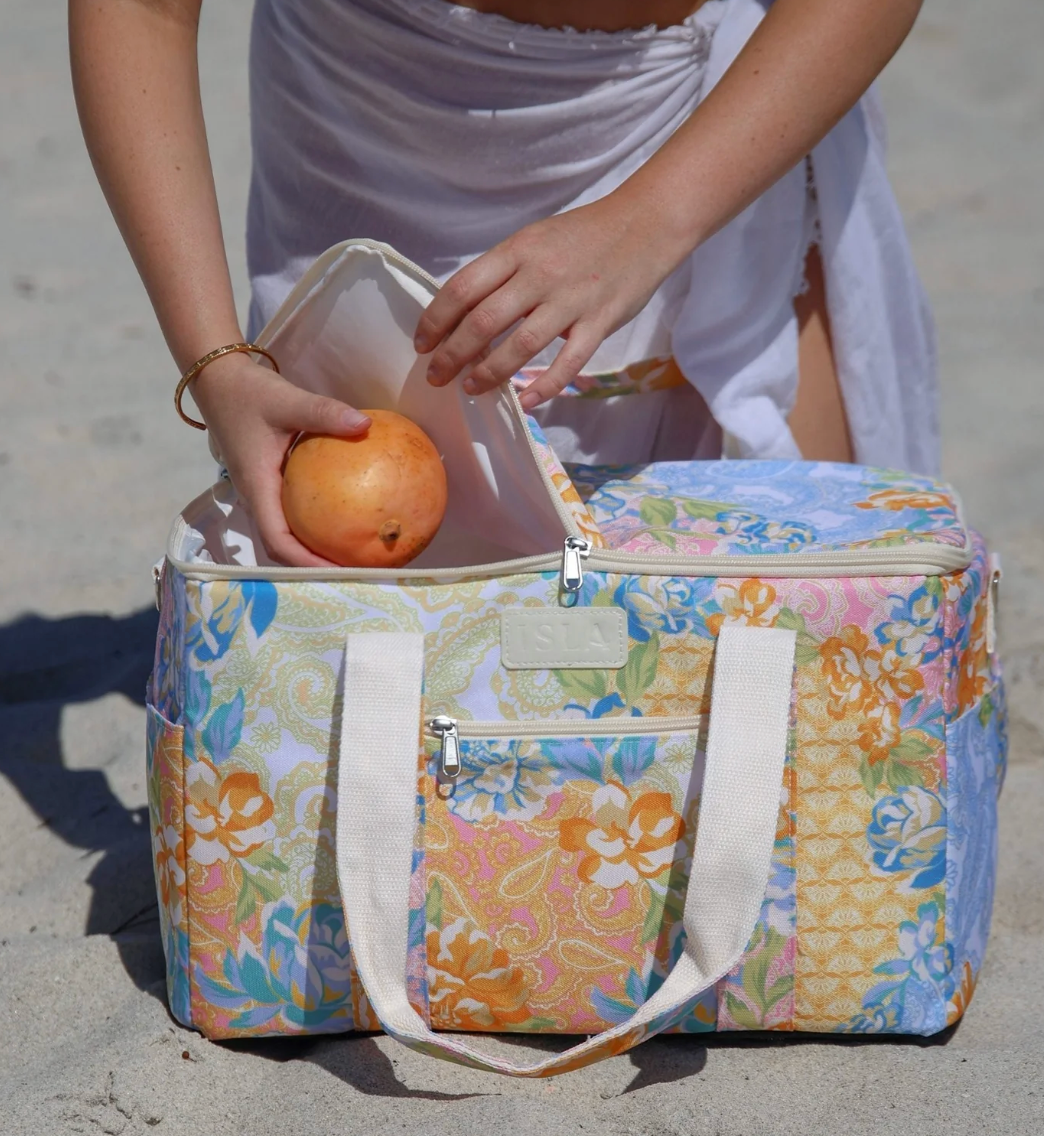 The&nbsp;Gardenia&nbsp;large cooler bag&nbsp;has a vibrant patchwork print of bohemian motifs and romantic florals. With insulation for freshness and easy to wipe-clean, Gardenia makes practical more playful.&nbsp;Spacious at 27L, it’s the perfect choice for family-sized picnics and beachside feasts.

- Premium and durable&nbsp;recycled&nbsp;polyester&nbsp;fabric&nbsp;made from plastic bottles&nbsp;

-&nbsp;W40 x D26 x H26cm (27L)

- Insulated internal lining

- Seek sun protection with a matching&nbsp;beac