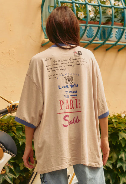 THE PARIS LOVE NOTES TEE - CREAM

This tee isn’t just fabric on skin. It’s a love note you get to slip into. A gentle reminder in oversized cotton that you’re allowed to slow down, breathe, and hold yourself close.

Cut in our signature oversized fit, it drapes like a soft promise, made for mornings that stretch into nights, and all the in-between moments where comfort matters most.