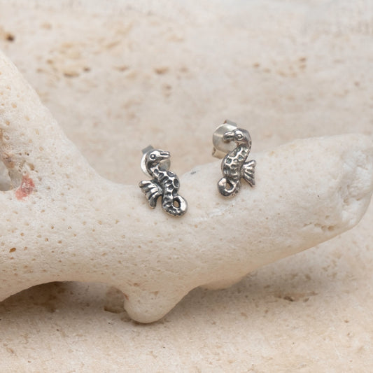 Introducing our Seahorse Mini Studs, where oceanic grace meets intricate craftsmanship. These exquisite stud earrings are finely crafted from sterling silver to capture the essence of the seahorse in remarkable detail.

The seahorse, a symbol of patience and persistence in the underwater world, is elegantly depicted in these miniature works of art. With their delicate design, these studs are perfect for adding a touch of marine charm to any outfit.