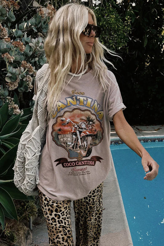 COCO CANTINA BIKER TEE – TAUPE

Channel effortless cool with the Coco Cantina Biker Tee in a perfectly sun-faded taupe. Inspired by desert highways and vintage biker energy, this tee features a bold motorcycle graphic and “Coco Cantina” emblem that feels straight out of a retro postcard. Designed in an oversized silhouette, it's crafted from breathable cotton for that lived-in, throw-on-and-go feel.