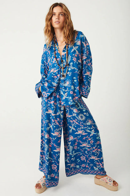 Elevate your wardrobe with the Desert Bandita Wide Leg Pant in Cobalt. Crafted with luxurious silk-like Jacquard woven fabric, these pants feature playful desert motifs in eye-catching hues. The statement wide-leg silhouette provides an effortlessly elegant drape, perfect for both daytime adventures and evening soirees. Pair with the matching Desert Bandita Shirt and chunky sandals for a chic off duty look that exudes confidence and sophistication.