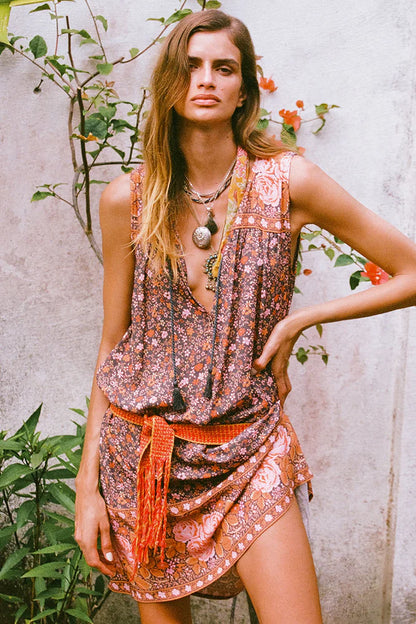 Our Love Jetty Sleeveless Tunic Dress in Balmy Nights is a Spell favourite style reimagined in dreamy deep hues spliced together with striking border details and rambling floral print. An easy throw on piece, our tunic is light and breezy featuring neck ties with tassels for some 70’s bohemian charm. Style with boots and a white blouse layered underneath or over your favourite denim with beads and bangles, the possibilities are endless!