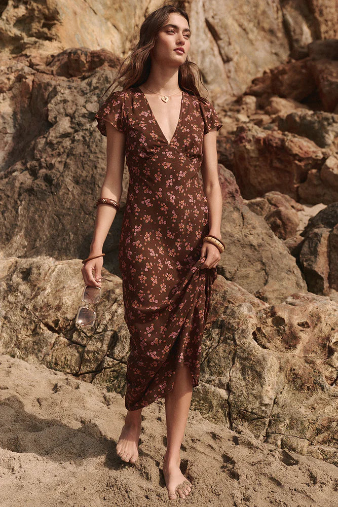 Our Melody Bias Maxi Dress in Antique Walnut is crafted for the heartbreakers. An exquisite showstopper, our dress is cut to flatter the waist and glide over the hips accentuating your silhouette. Soft pink ditsy florals ramble across a backdrop of deep chocolate brown, flutter sleeves float sweetly at the shoulder and the V neckline and low V back adds a sensual touch. Pair with mules and fine jewels for date night or with combat boots and a slouch bag for something a little more rock and roll.