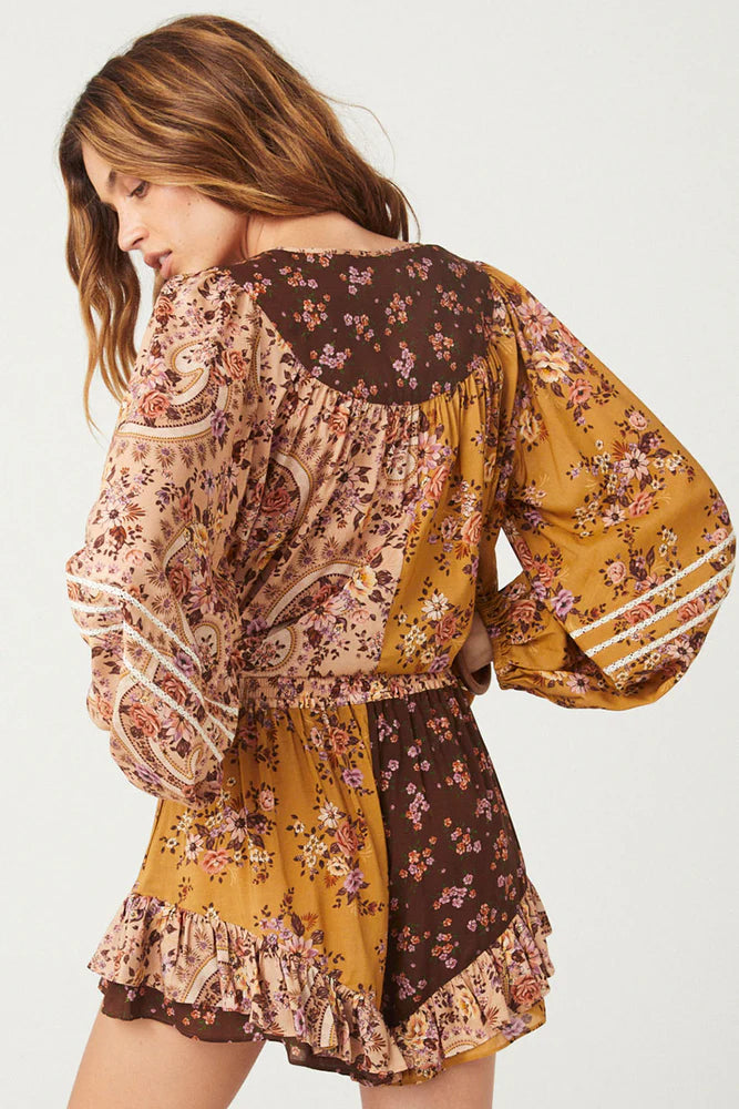 The Melody Blouse in Woodstock is crafted for the rebel hearts. Our newest blouse features a unique patchwork print placement from the design team ~ our honeyed amber print to one side, our rambling florals in pink and cream to the other with our retro brown and ditsy floral print across the back yoke complete this statement style and echo the free spirit of our rebel muse. Inserted ladder lace frames the billowing sleeves, a button down front offers styling versatility while the neck line includes ties wit