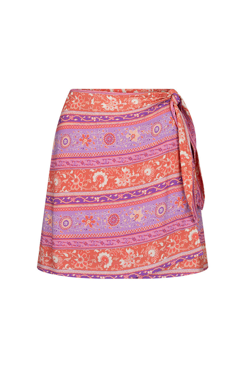 A popular style reimagined, the SPELL Sunshine Bandit Wrap Mini Skirt arrives in our blazing Cayenne colourway featuring our signature floral patterns and repeating border motifs in hues of gold, vivid purple, pink, lilac and chili red. Add a pop of colour to your everyday styling with our newest wrap mini