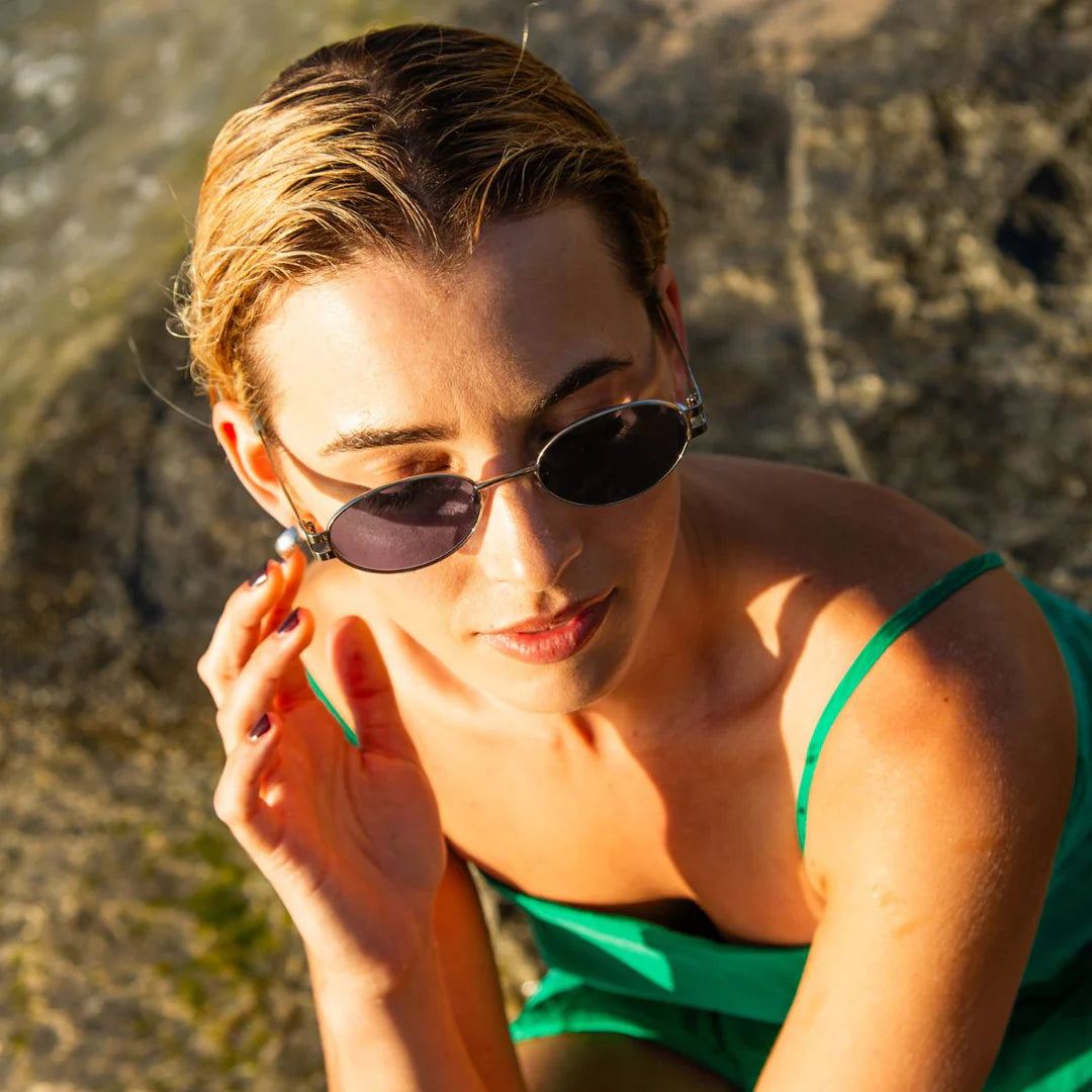 Style with Stevie. A stylish blend of nostalgic charm and contemporary sophistication. Taking inspiration from the iconic '90s, these sunglasses feature a sleek oval shape with carefully tapered temples that add a refined touch to any look. Crafted with a modern metal frame with a milky sage coloured plant based acetate detailing, the Stevie sunglasses are the ultimate accessory to elevate your ensemble, whether you're lounging by the beach or dressing up for an event.

Designed in Australia.