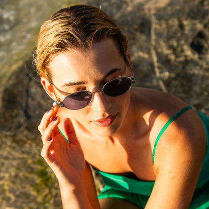 Style with Stevie. A stylish blend of nostalgic charm and contemporary sophistication. Taking inspiration from the iconic '90s, these sunglasses feature a sleek oval shape with carefully tapered temples that add a refined touch to any look. Crafted with a modern metal frame with a milky sage coloured plant based acetate detailing, the Stevie sunglasses are the ultimate accessory to elevate your ensemble, whether you're lounging by the beach or dressing up for an event.

Designed in Australia.