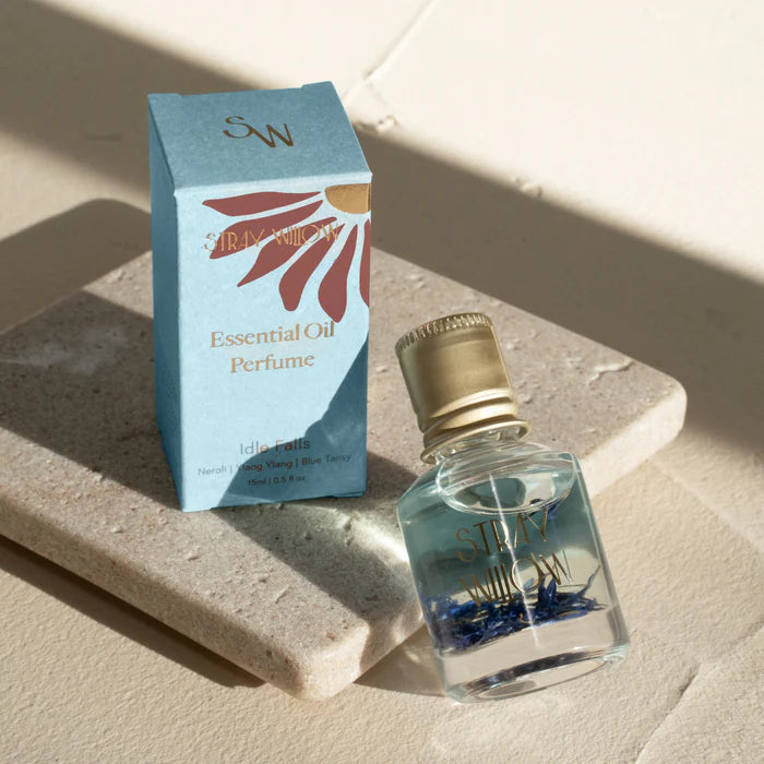 Idle Falls is an Australian-made natural perfume roller created to bring a sense of tranquility and calm. This serene aromatherapy blend features uplifting Grapefruit and Bergamot, floral notes of Ylang Ylang and Neroli, and the soothing presence of Blue Tansy and soft Vanilla. Housed in a sustainable recyclable glass roller bottle, it's crafted with natural botanical ingredients and pure essential oils—offering a gentle, grounding scent to support mindful self-care moments, clarity, and emotional ease. The